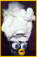 furby with fur being pulled off his head